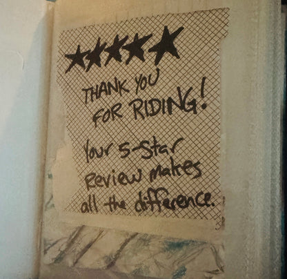 Collage with envelope markings. In sharpie: five start. Thank you for riding! Your 5-star review makes all the difference.