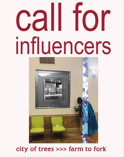 a poster with large text that reads call for influencers, underneath which a person in a cape is reaching through a beam , becoming transformed as they do so, to reach the thermostat in a clinic waiting room. An image in a picture frame reveals the front of Prism Art Space as the facility prepared for the Art City show. Below the image, the text "city of trees >>> farm to fork."